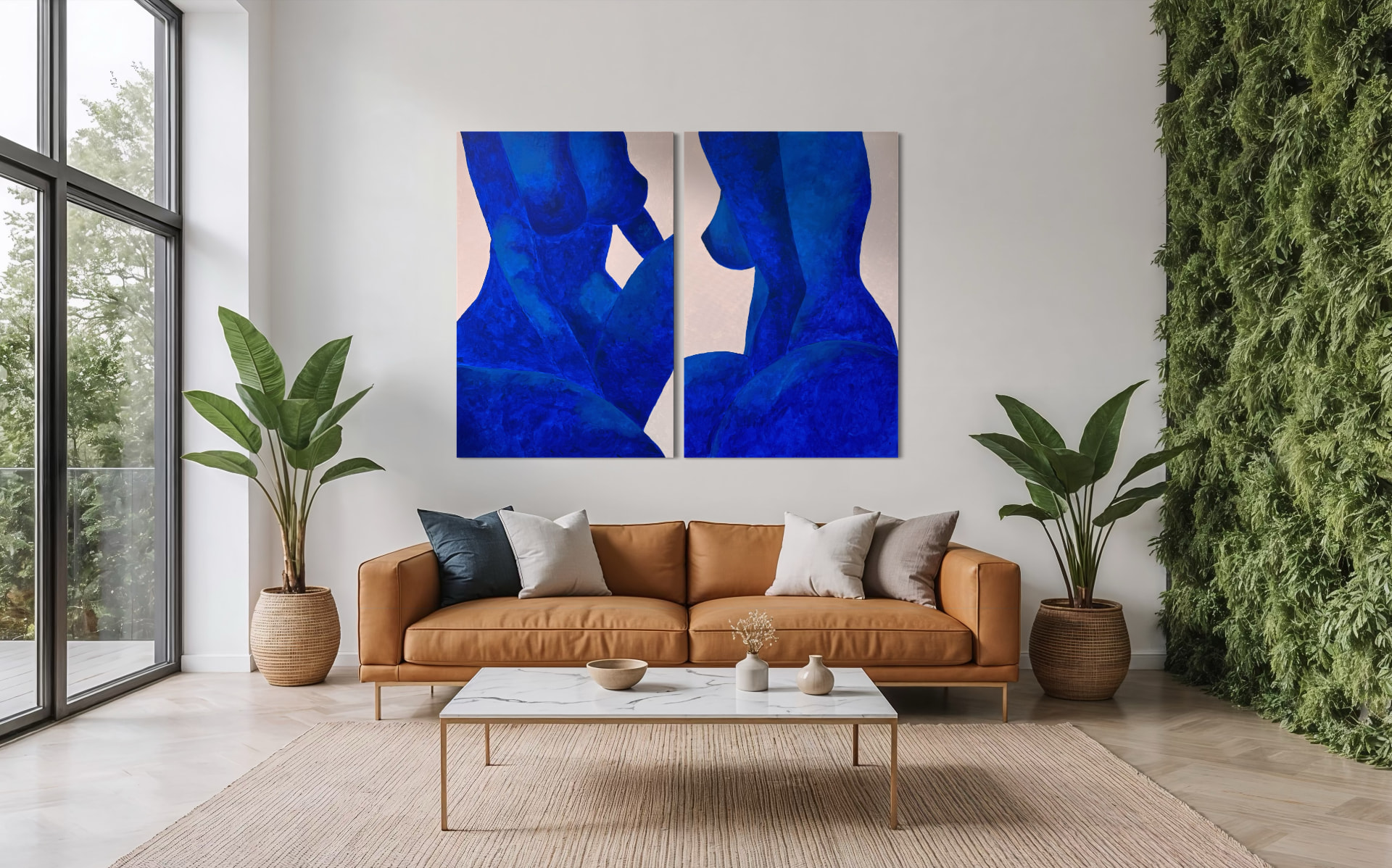 Two blue abstract paintings by Sonia Anton hanging in a modern living room
